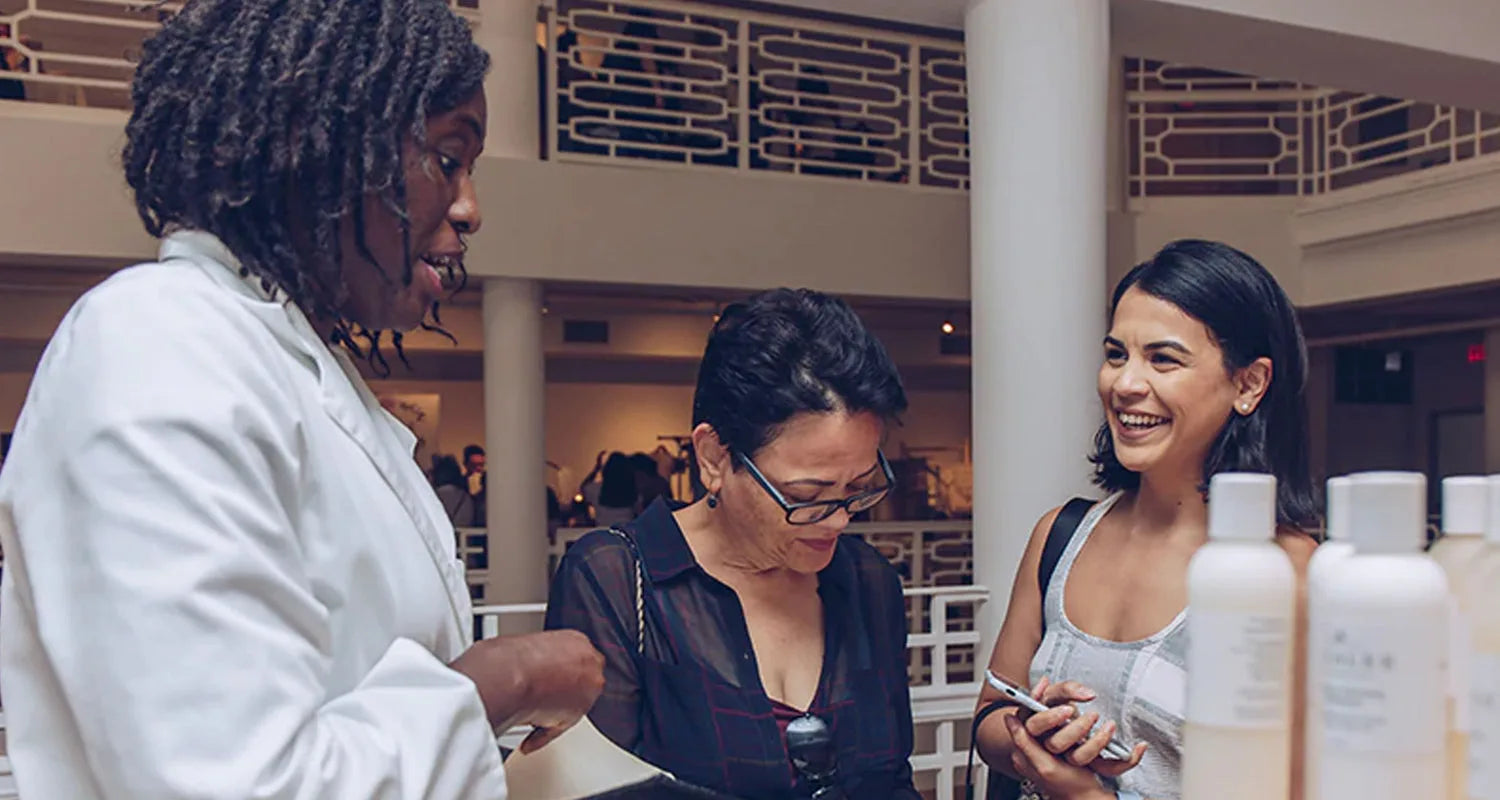 Sayblee Darsale in her white coat with clients